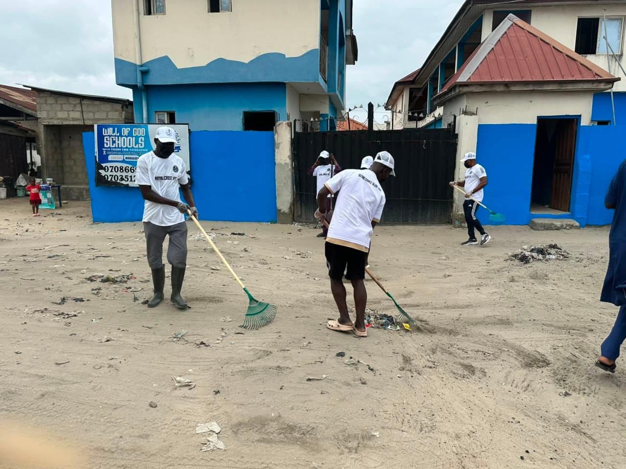 Grassroots community collaboration: players and volunteers improving neighborhood sanitation.